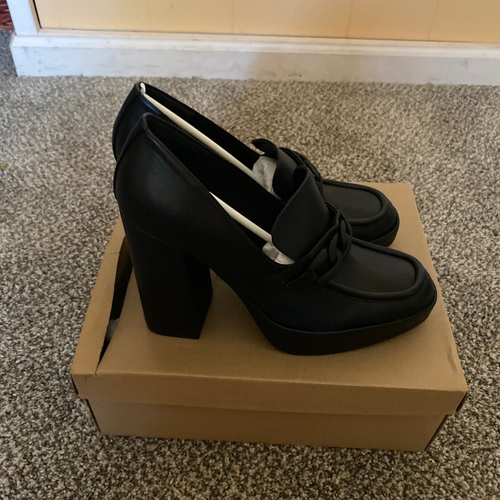 Black platform shoes with chunky heels